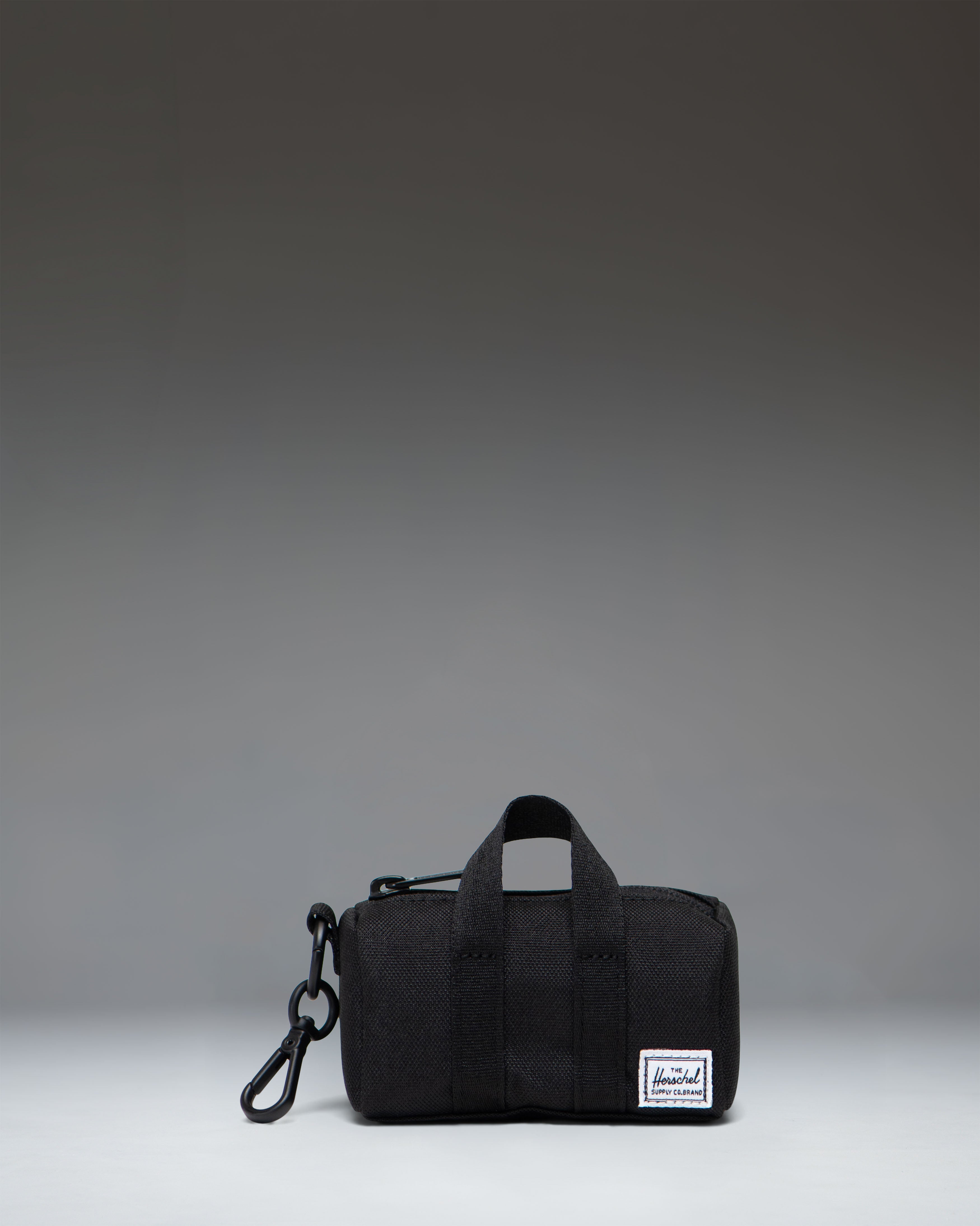 herschel-supply-co-novel-duffle-bag-charm-porte-cl-s-mini-sac image 1